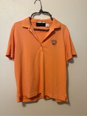 John Daly woman’s golf shirt.